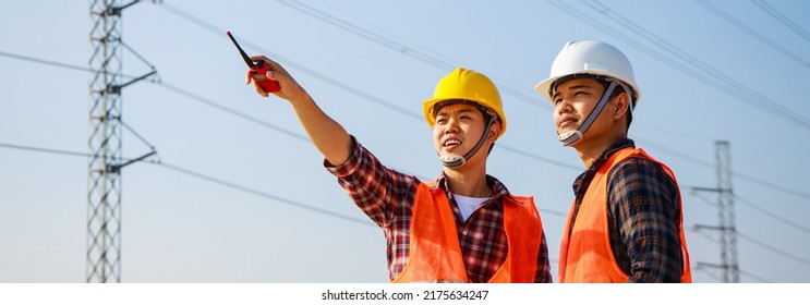 Banner Size. Asian Engineer Manager And Foreman Discussion And Pointing To Construction Site