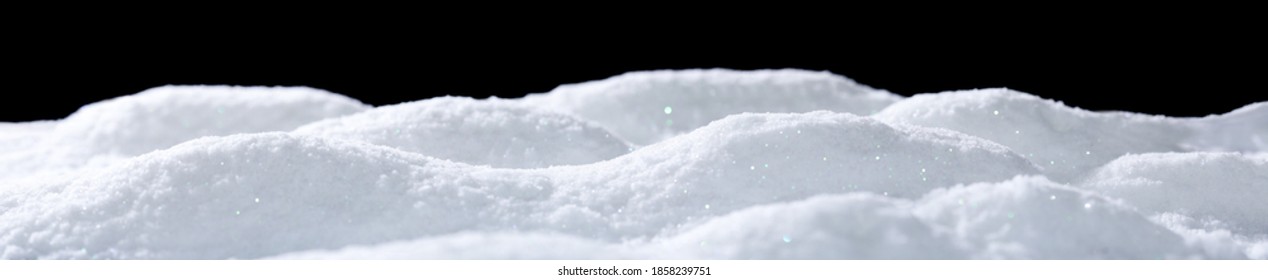 Banner of sparkling fuffy white snow hills isolated on black