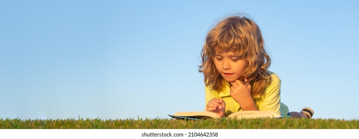 Banner with spring kids portrait. Kids imagination, innovation and inspiration children. Outdoor portrait of little boy reading a book.