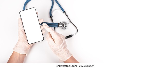 Banner With Stethoscope And Doctor Hands With Phone Mockup. Online Medical Consultation, Remote Communication With Patient. Health Tracker App In Smartphone. Copy Space. High Quality Photo