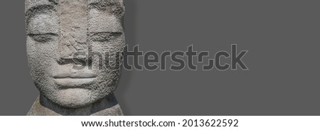 Banner with stone statue of a beautiful ancient Inca woman of Latin America at solid background with copy space. Concept historical heritage