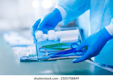 Banner surgery med clinic. Closeup scrub nurse taking medical instruments for operation with doctor on background. Clear light, blue toning with sunlight - Powered by Shutterstock