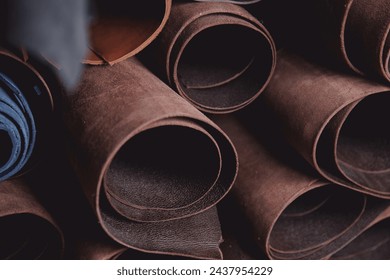 Banner of tailor, leather rolls of natural color in workshop. Materials for DIY handmade craft. - Powered by Shutterstock