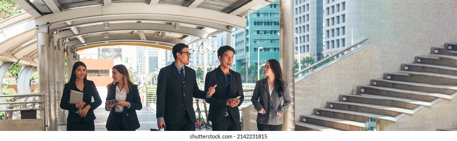 Banner team building office Crowd business people walking teamwork meeting in modern city lifestyle. Panorama Crowdy group of people busy life  businesspeople walking on street city with copy space