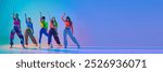 Banner. Teenage girls dancing hip-hop in neon light against gradient studio background with negative space to insert text. Concept of sport and hobby, childhood, friendship, motion. Dance lessons.