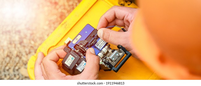 Banner template Technician Fiberoptic Fusion Splicing. Worker connecting for Cable Internet signal and Wire connection with Fiber Optic Fusion Splicing machine,fiber optic cable splice machine in work