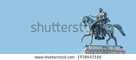Banner with top roof sculpture of Greek goddess Muse riding Pegasus, a winged horse, at Vienna State Opera House, Vienna, Austria, with copy space. Concept of Cultural Heritage and Travel