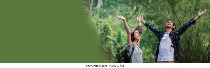 Banner Or Web Header Ratio Image. Happy Couple Hiking Outdoors In Forest. Active Young Caucasian Woman Hiker And Asian Man.