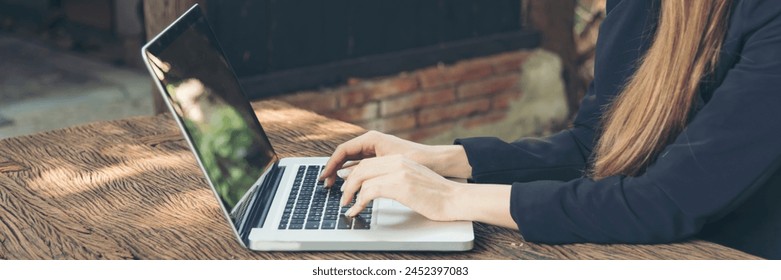 Banner Woman typing laptop computer online meeting at home office work from home. Asian businesswoman use notebook laptop. Programmer woman typing keyboard laptop read online website with copy space - Powered by Shutterstock