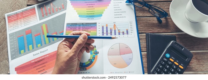 Banner woman working office desk reading financial report finance chart graph on table. Wide tax audit woman hands working paperwork office. Banner Businesswoman Audit financial with copy space - Powered by Shutterstock