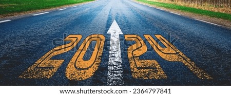 Banner.New year 2024 written on highway.future,work start run line vision concept.Nature landscape road happy new year celebration in the beginning of 2024 for fresh and successful start.