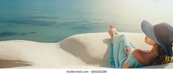 Banner Young woman with hat on the white rocks on the beach Sicily. High quality photo - Powered by Shutterstock