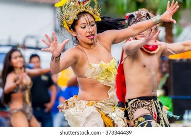 Banos De Agua Santa, Ecuador - November29, 2014 : Group Of Youth Huaorani Dancing On City Streets Of South America 