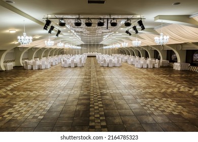 Banquet Hall For Wedding Reception With Served Tables And Spacious Dance Floor