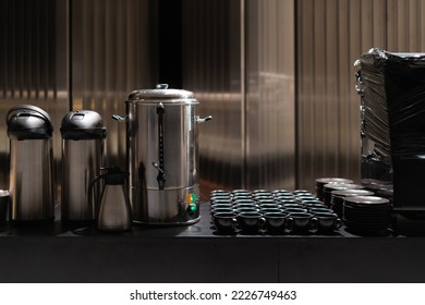 Banquet, table full of empty cups and plates. Formal dinner, ready to serve hot drinks.