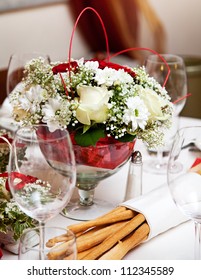 Banquet Table Setting With Bouquet And Grissini.