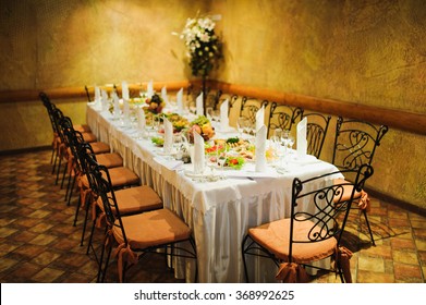 Banquet wedding table setting on evening reception awaiting guests