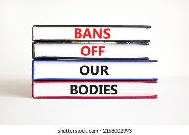 Bans off our bodies symbol. Concept words Bans off our bodies on books on a beautiful white table white background. Women rights concept. Business social issues and bans off our bodies concept.
