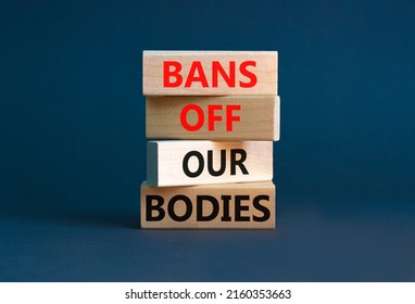 Bans off our bodies symbol. Concept words Bans off our bodies on wooden blocks on a beautiful grey table grey background. Women rights concept. Business social issues and bans off our bodies concept.