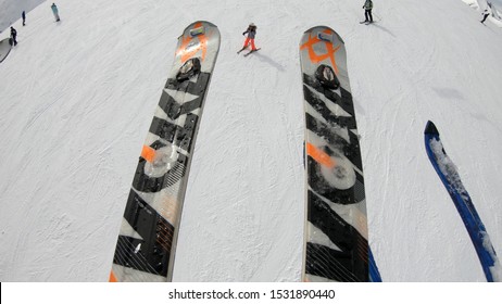 Bansko, Bulgaria - Circa Mar, 2018: Close Up POV Of Skiers Legs In Ski Lift With Snowboard And Skis, Concept, Slow Motion