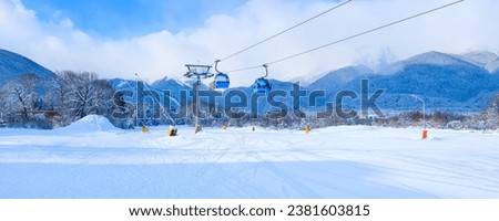 Bansko, Bulgaria winter ski resort banner with ski slope, gondola lift cabins and Pirin mountains view