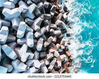 BANTEN, INDONESIA - JULY 10th, 2022 :Breakwater Is An Infrastructure Built To Break Waves Or Waves, By Absorbing Some Of The Wave Energy. The Photo Was Taken Using A DJI Drone During The Day.