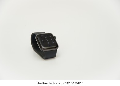 Banting Selangor, Malaysia - February 11, 2021: Black Apple Watch SE With Passcode Display On A White Background