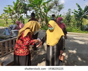 Bantul, Indonesia March 18, 2021, Guests Who Attended The Wedding During The Covid 19 Period, Their Body Temperature Was Measured By The Receptionist