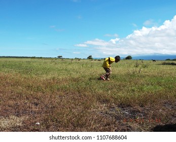 Banyuwangi ,Baluran Indonesia  Maret  25 , 2015 :  Boy In Field