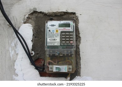 Banyuwangi, Indonesia - February 26 2022 : Prepaid Electricity Meter For Home Provided By PLN (Indonesian Government Electricity Company), Electric Meter By Itron And Schneider Electric