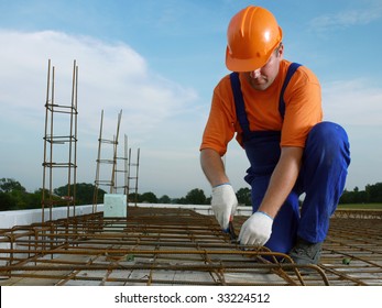 Bar bender fixing steel reinforcement for house concrete floor slab - Shutterstock ID 33224512