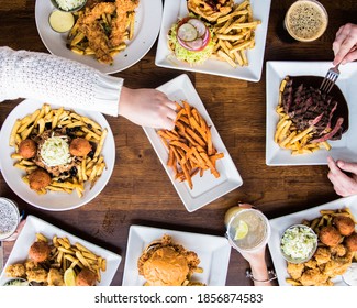 Bar Food Spread, Hand Reaching For Fries