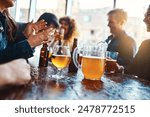 Bar, group and hands for beer, fun and party for joy, reunion and celebration for friends and event. Table, alcohol and drinks to enjoy, glass and people in club, break and together in Los Angeles