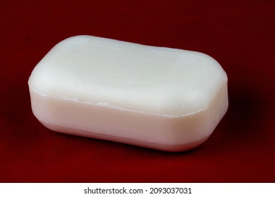 Bar Of Hand Wash Soap Against A Red Background