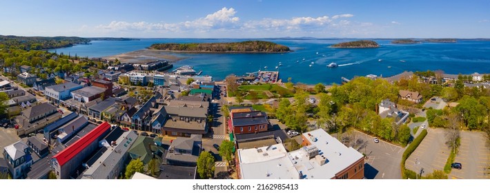 Bar Harbor historic town center on Main Street and Bar Island in Frenchman Bay aerial view, Bar Harbor, Maine ME, USA. 