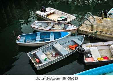 Bar Harbor, Maine, USA - September 24, 2013: Multiple Fishing Boats Tied To A Bar Harbor Boat Dock And Floating In Dingy Water.