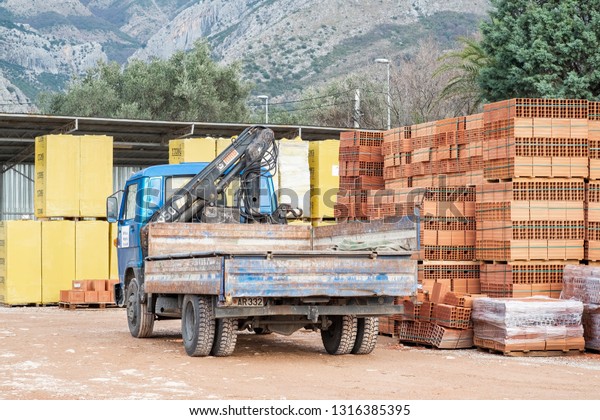 Bar, Montenegro, February 04, 2019: Semi-truck is\
parked in the parking lot at the building materials  warehouse in\
the open air