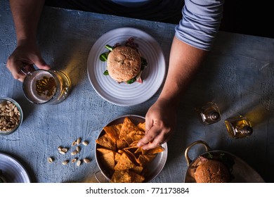 Bar Party Table Beer Hamburger Drinking Eating Person Holding Burger Beef Steak Overhead Copy Space 
