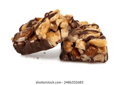 Bar with peanuts, hazelnuts, caramel and chocolate on a white background. View from above. Nut bar isolate. Sugar - Powered by Shutterstock