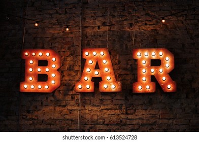 Bar Signboard On Brick Wall 