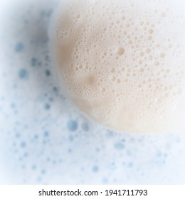 Bar Soap. White Toilet Soap With Lather Isolated On Blue Background. Macro, Close Up, Top View.