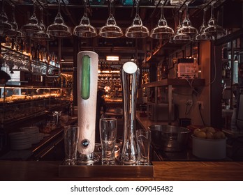 Bar with taps and glasses