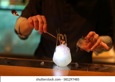 Bar Tender Making A Cocktail
