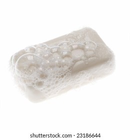 Bar Of White Soap With Bubbles On White