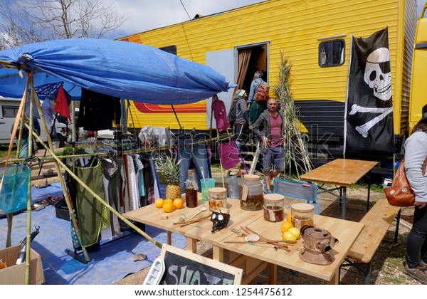 Barao de Sao Joao, Algarve Province, Portugal -\
March 25, 2018: Hippie Market. People, dogs,kids ,vehicles, art and\
dealers at the flea market.Gypsy Market, take place every fourth\
Sunday of the month