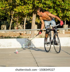 BARAO DE SAO JOAO, LAGOS PORTUGAL SEPTEMBER 14 2019: Amateur Bike Polo Player At Speed Hot And Sweaty