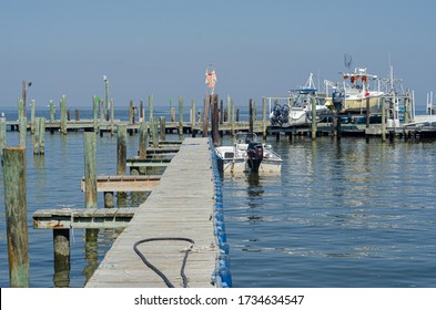 BARATARIA, LA, USA - OCTOBER 26, 2014: Boats Alongside Docks In Barataria Bay