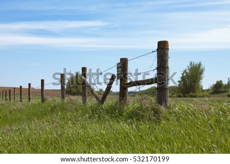 Barb Wire Fence With a No Hunting Sign
