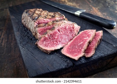 Barbecue Aged Point Steak On Burnt Wooden Board