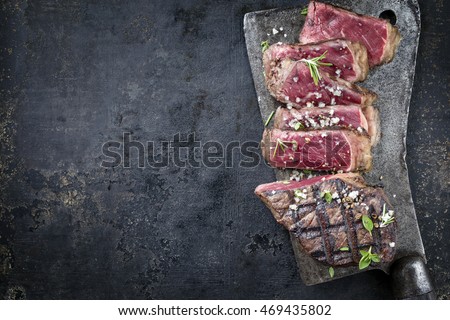 Barbecue Aged Roast Beef on old Metal Sheet